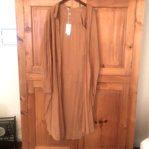 Never worn w tags Tiny hole